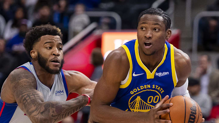 Nov 19, 2021; Detroit, Michigan, USA; Golden State Warriors forward Jonathan Kuminga (00) drives to the basket against Detroit Pistons forward Saddiq Bey (41) during the second quarter at Little Caesars Arena. Mandatory Credit: Raj Mehta-Imagn Images