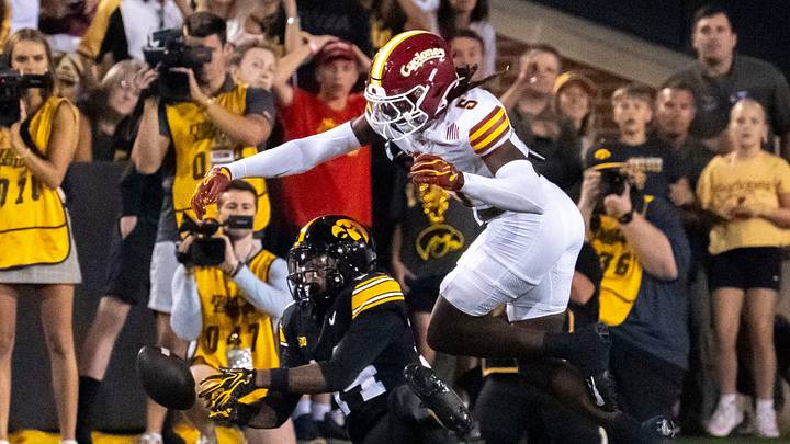 Iowa Hawkeyes wide receiver Tony Diaz (14) tries to haul in a pass as Iowa State defensive back Beni Ngoyi (5) defends during the Cy-Hawk football game Sept. 12, 2026 at Kinnick Stadium in Iowa City, Iowa. Iowa Hawkeyes wide receiver Tony Diaz (14) tries to haul in a pass as Iowa State defensive back Beni Ngoyi (5) defends during the Cy-Hawk football game Sept. 12, 2026 at Kinnick Stadium in Iowa City, Iowa.