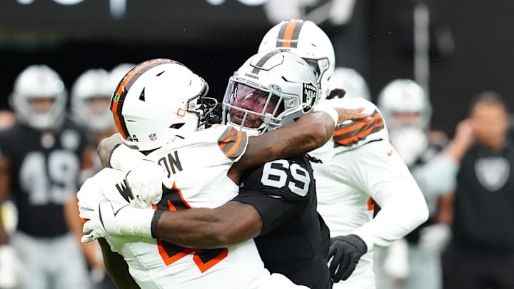 Sep 29, 2024; Paradise, Nevada, USA; Las Vegas Raiders defensive tackle Adam Butler (69) tackles Cleveland Browns quarterback Deshaun Watson (4) during the first quarter at Allegiant Stadium. Mandatory Credit: Stephen R. Sylvanie-Imagn Images