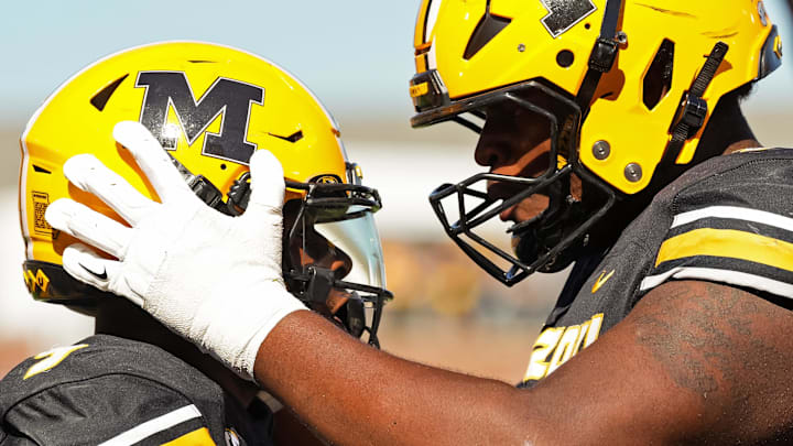 Oct 19, 2024; Columbia, Missouri, USA; Missouri Tigers running back Marcus Carroll (9) celebrates with offensive lineman Mitchell Walters (75) after scoring a touchdown during the second half against the Auburn Tigers at Faurot Field at Memorial Stadium. Mandatory Credit: Jay Biggerstaff-Imagn Images