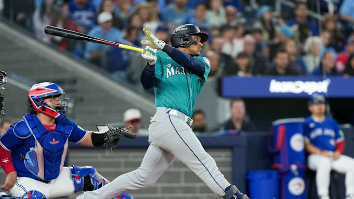 Oct 13, 2025; Toronto, Ontario, CAN; Seattle Mariners infielder Jorge Polanco (7) hits a three run home run in the fifth inning against the Toronto Blue Jays during game two of the ALCS round for the 2025 MLB playoffs at Rogers Centre. Mandatory Credit: Nick Turchiaro-Imagn Images Oct 13, 2025; Toronto, Ontario, CAN; Seattle Mariners infielder Jorge Polanco (7) hits a three run home run in the fifth inning against the Toronto Blue Jays during game two of the ALCS round for the 2025 MLB playoffs at Rogers Centre. Mandatory Credit: Nick Turchiaro-Imagn Images