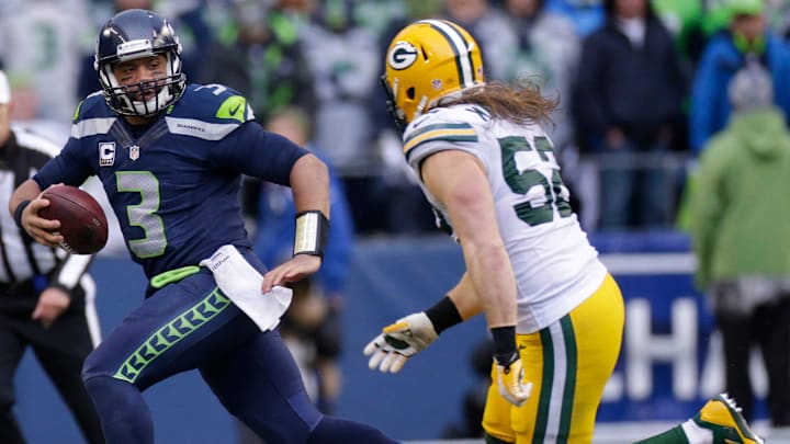 Seattle Seahawks quarterback Russell Wilson runs for four yards before before run down. Seattle Seahawks quarterback Russell Wilson runs for four yards before before run down.