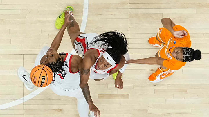 Ohio State Buckeyes forward Ajae Petty (1) and forward Cotie McMahon (32) defend Tennessee Lady Vols guard Jewel Spear (0) during the second round of the women's NCAA Tournament at Value City Arena in Columbus on March 23, 2025. Ohio State lost 82-67.