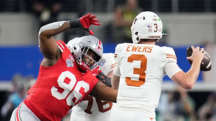 Ohio State Buckeyes defensive end Eddrick Houston (96) pressures Texas Longhorns quarterback Quinn Ewers (3) during the second half of the Cotton Bowl Classic College Football Playoff semifinal game at AT&T Stadium in Arlington, Texas on Jan. 10, 2025. Ohio State won 28-14.