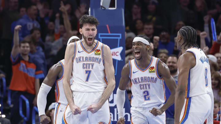 Dec 8, 2023; Oklahoma City, Oklahoma, USA; Oklahoma City Thunder forward Chet Holmgren (7), and guard Shai Gilgeous-Alexander (2) celebrate after Chet Holmgren scores a basket against the Golden State Warriors during the second half at Paycom Center. Mandatory Credit: Alonzo Adams-USA TODAY Sports