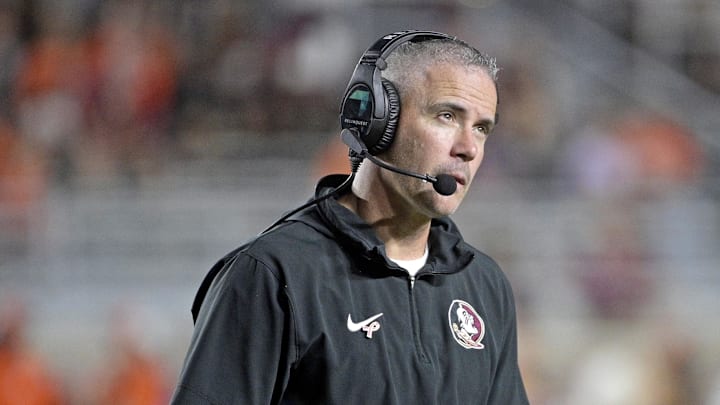 Oct 5, 2024; Tallahassee, Florida, USA; Florida State Seminoles head coach Mike Norvell looks on during the second half against the Clemson Tigers at Doak S. Campbell Stadium. Mandatory Credit: Melina Myers-Imagn Images Oct 5, 2024; Tallahassee, Florida, USA; Florida State Seminoles head coach Mike Norvell looks on during the second half against the Clemson Tigers at Doak S. Campbell Stadium. Mandatory Credit: Melina Myers-Imagn Images