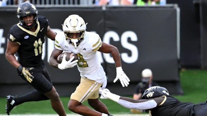 Sep 27, 2025; Winston-Salem, North Carolina, USA; Georgia Tech Yellow Jackets wide receiver Malik Rutherford (8) runs the ball during the second quarter against the Wake Forest Demon Deacons at Allegacy Federal Credit Union Stadium. Mandatory Credit: Zachary Taft-Imagn Images