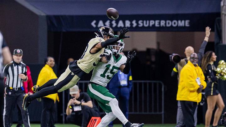 Dec 21, 2025; New Orleans, Louisiana, USA; New Orleans Saints safety Jonas Sanker (33) blocks the pass to New York Jets wide receiver Adonai Mitchell (15) during the second half at Caesars Superdome. Mandatory Credit: Stephen Lew-Imagn Images Dec 21, 2025; New Orleans, Louisiana, USA; New Orleans Saints safety Jonas Sanker (33) blocks the pass to New York Jets wide receiver Adonai Mitchell (15) during the second half at Caesars Superdome. Mandatory Credit: Stephen Lew-Imagn Images