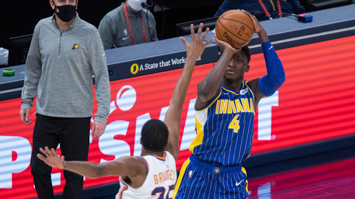 Jan 9, 2021; Indianapolis, Indiana, USA; Indiana Pacers guard Victor Oladipo (4) shoots the ball while Phoenix Suns forward Mikal Bridges (25) defends in the fourth quarter at Bankers Life Fieldhouse. Mandatory Credit: Trevor Ruszkowski-Imagn Images Jan 9, 2021; Indianapolis, Indiana, USA; Indiana Pacers guard Victor Oladipo (4) shoots the ball while Phoenix Suns forward Mikal Bridges (25) defends in the fourth quarter at Bankers Life Fieldhouse. Mandatory Credit: Trevor Ruszkowski-Imagn Images