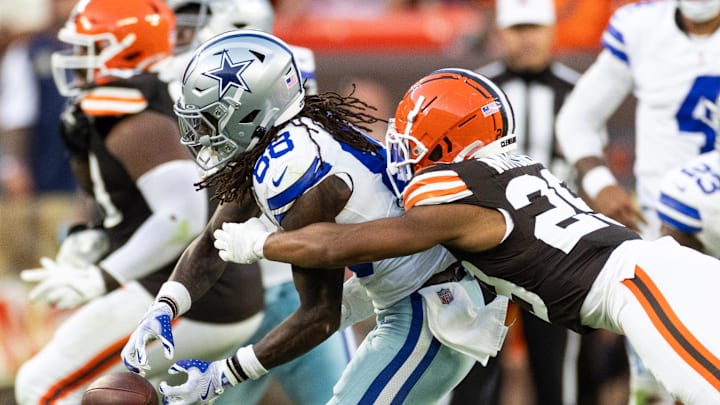 Sep 8, 2024; Cleveland, Ohio, USA; Cleveland Browns cornerback Cameron Mitchell (29) breaks up a pass for Dallas Cowboys wide receiver CeeDee Lamb (88) during the fourth quarter at Huntington Bank Field. Mandatory Credit: Scott Galvin-Imagn Images