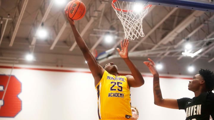 Montverde   s Derik Queen (25) goes for a lay up against Whitehaven   s Bob Hickerson (20) during a