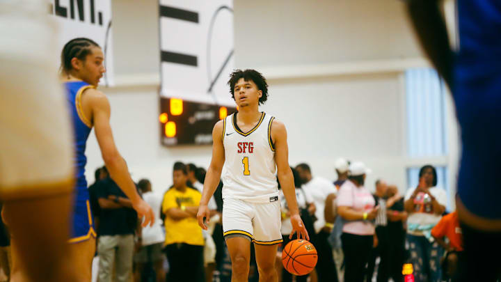Team SFG’s Brayden Burries (1) brings the ball up the court against Team Boo Williams during the Nike Elite Youth Basketball League session one on Friday, April 26, 2024 at the Memphis Sports & Event Center in Memphis, Tenn.