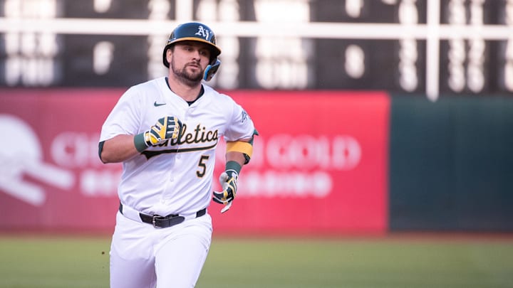 May 21, 2024; Oakland, California, USA; Oakland Athletics designated hitter J.D. Davis (5) rounds the bases after hitting a home run against the Colorado Rockies during the third inning at Oakland-Alameda County Coliseum. Mandatory Credit: Ed Szczepanski-USA TODAY Sports