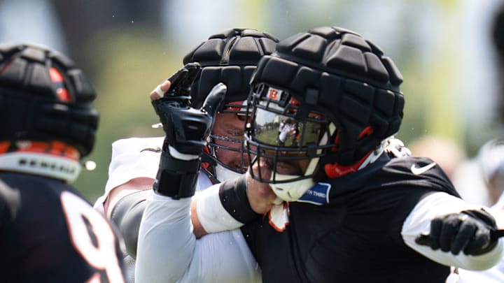 Cincinnati Bengals guard Alex Cappa (65) blocks Cincinnati Bengals defensive tackle Sheldon Rankins (98) during Cincinnati Bengals training camp in Cincinnati on Friday, July 26, 2024. Cincinnati Bengals guard Alex Cappa (65) blocks Cincinnati Bengals defensive tackle Sheldon Rankins (98) during Cincinnati Bengals training camp in Cincinnati on Friday, July 26, 2024.