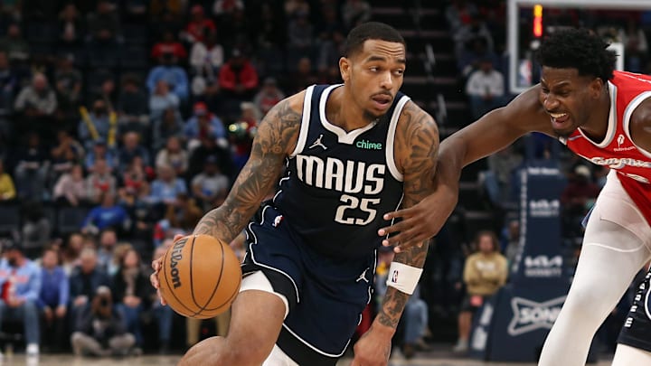 Jan 6, 2025; Memphis, Tennessee, USA; Dallas Mavericks forward P.J. Washington (25) drives to the basket as Memphis Grizzlies forward Jaren Jackson Jr. (13) defends during the second quarter at FedExForum. Mandatory Credit: Petre Thomas-Imagn Images