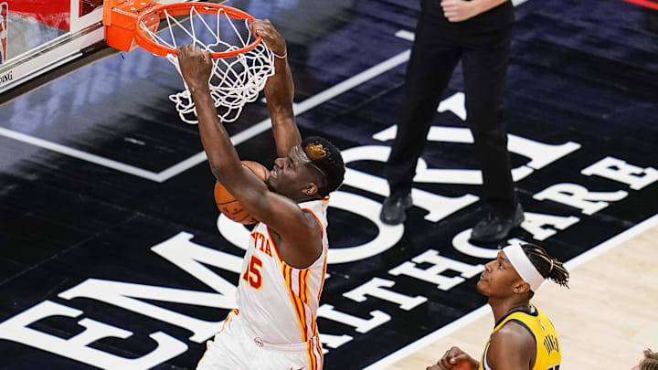 Apr 18, 2021; Atlanta, Georgia, USA; Atlanta Hawks center Clint Capela (15) dunks behind Indiana Pacers center Myles Turner (33) during the first quarter at State Farm Arena. Mandatory Credit: Dale Zanine-Imagn Images