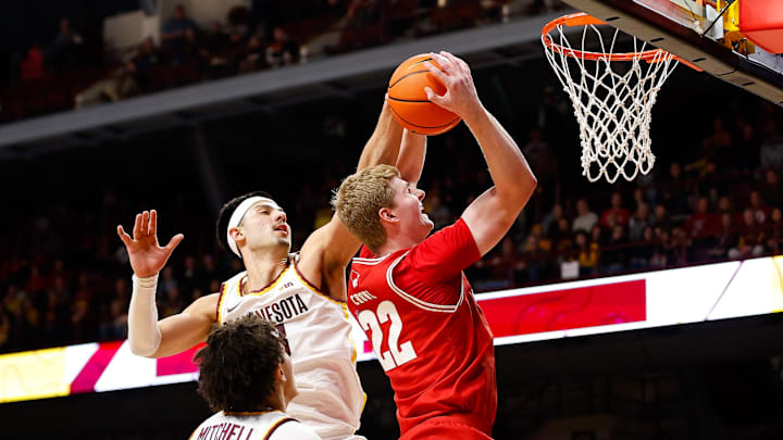 Jan 23, 2024; Minneapolis, Minnesota, USA; Minnesota Golden Gophers forward Dawson Garcia (3) blocks a shot by Wisconsin Badgers forward Steven Crowl (22) during the second half at Williams Arena. Mandatory Credit: Matt Krohn-Imagn Images