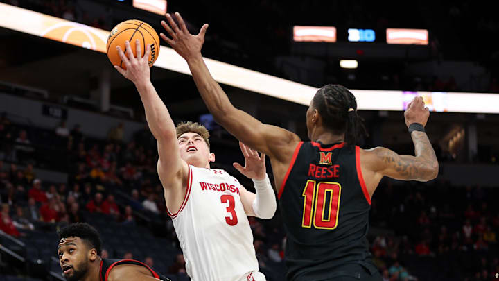 Mar 14, 2024; Minneapolis, MN, USA; Wisconsin Badgers guard Connor Essegian (3) shoots as Maryland