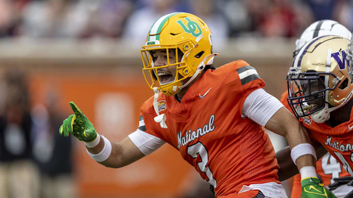 Feb 3, 2024; Mobile, AL, USA; National defensive back Evan Williams of Oregon (3) celebrates his interception during the first half of the 2024 Senior Bowl football game at Hancock Whitney Stadium.