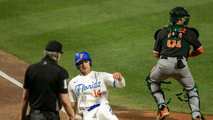 Florida's utility Jac Caglianone (14) scores a run against the Miami Hurricanes, Friday, March 3, 2023, at Condron Family Baseball Park in Gainesville, Florida. The Gators beat the Hurricanes 10-4 in Game 1. [Cyndi Chambers/ Gainesville Sun] 2023

Gator Baseball March 3 2023 Condron Family Ballpark Miami Hurricanes