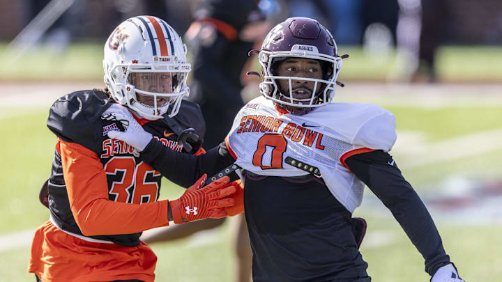 Jan 30, 2024; Mobile, AL, USA; American defensive back Jaylin Simpson of Auburn (36) and American wide reciever Ainias Smith of Texas A&M (0) work in passing drills during practice for the American team at Hancock Whitney Stadium. Mandatory Credit: Vasha Hunt-USA TODAY Sports