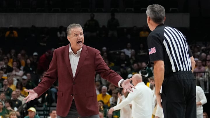Nov 9, 2024; Dallas, Texas, USA;  Arkansas Razorbacks head coach John Calipari argues with an official during a break in play against the Baylor Bears during the first half at American Airlines Center. Mandatory Credit: Chris Jones-Imagn Images