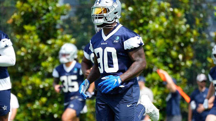 Jun 5, 2024; Frisco, TX, USA;  Dallas Cowboys defensive end DeMarcus Lawrence (90) goes through a drill during practice at the Ford Center at the Star Training Facility in Frisco, Texas. Mandatory Credit: Chris Jones-Imagn Images