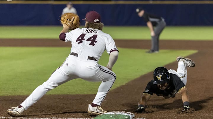 May 23, 2024; Hoover, AL, USA; Vanderbilt Commodores utility Matthew Polk (1) dives safely back to first as Mississippi State Bulldogs infielder Hunter Hines (44) covers the bag during the SEC Baseball Tournament at Hoover Metropolitan Stadium. Mandatory Credit: Vasha Hunt-USA TODAY Sports