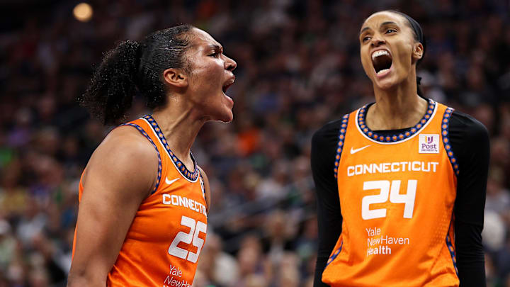 Sep 29, 2024; Minneapolis, Minnesota, USA; Connecticut Sun forward Alyssa Thomas (25) celebrates her shot with forward DeWanna Bonner (24) during the first half against the Minnesota Lynx of game one of the 2024 WNBA Semi-finals at Target Center. Mandatory Credit: Matt Krohn-Imagn Images