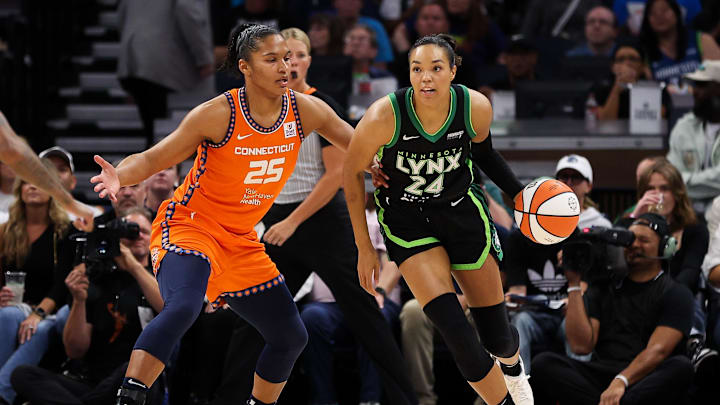 Sep 29, 2024; Minneapolis, Minnesota, USA; Minnesota Lynx forward Napheesa Collier (24) works around Connecticut Sun forward Alyssa Thomas (25) during the first half of game one of the 2024 WNBA Semi-finals at Target Center. Mandatory Credit: Matt Krohn-Imagn Images