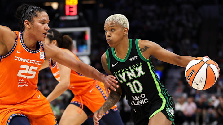 Sep 29, 2024; Minneapolis, Minnesota, USA; Minnesota Lynx guard Courtney Williams (10) works around Connecticut Sun forward Alyssa Thomas (25) during the second half of game one of the 2024 WNBA Semi-finals at Target Center. Mandatory Credit: Matt Krohn-Imagn Images