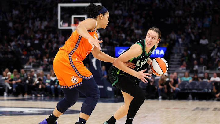Sep 29, 2024; Minneapolis, Minnesota, USA; Minnesota Lynx forward Alanna Smith (8) dribbles as Connecticut Sun forward Brionna Jones (42) defends during the second half of game one of the 2024 WNBA Semi-finals at Target Center. Mandatory Credit: Matt Krohn-Imagn Images Sep 29, 2024; Minneapolis, Minnesota, USA; Minnesota Lynx forward Alanna Smith (8) dribbles as Connecticut Sun forward Brionna Jones (42) defends during the second half of game one of the 2024 WNBA Semi-finals at Target Center. Mandatory Credit: Matt Krohn-Imagn Images