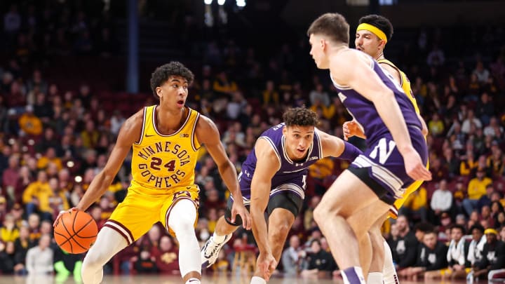 Feb 3, 2024; Minneapolis, Minnesota, USA; Minnesota Golden Gophers guard Cam Christie (24) works around Northwestern Wildcats guard Ty Berry (3) during the first half at Williams Arena. Mandatory Credit: Matt Krohn-USA TODAY Sports