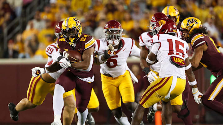 Oct 5, 2024; Minneapolis, Minnesota, USA; Minnesota Golden Gophers running back Marcus Major (24) runs the ball against the USC Trojans during the first half at Huntington Bank Stadium. Mandatory Credit: Matt Krohn-Imagn Images