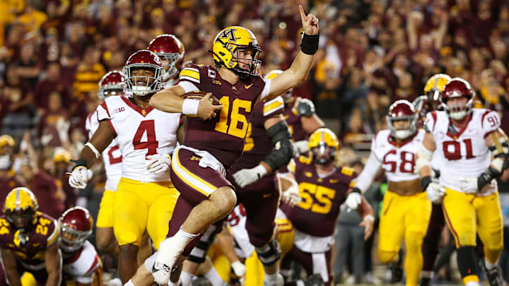Oct 5, 2024; Minneapolis, Minnesota, USA; Minnesota Golden Gophers quarterback Max Brosmer (16) runs for a touchdown against the USC Trojans during the second half at Huntington Bank Stadium. Mandatory Credit: Matt Krohn-Imagn Images