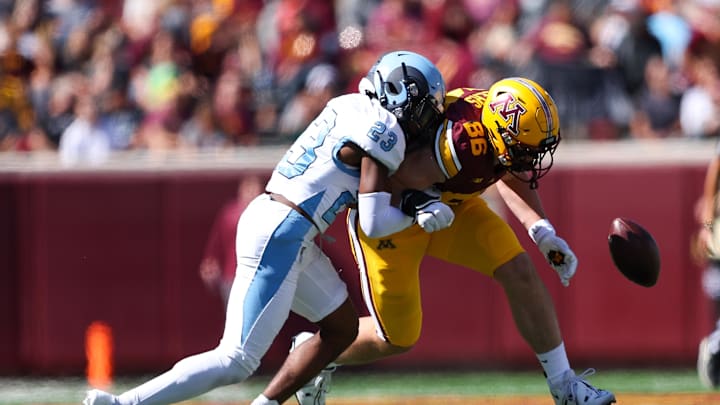 Sep 7, 2024; Minneapolis, Minnesota, USA; Rhode Island Rams defensive back Tremel States-Jones (23) breaks up a pass intended for Minnesota Golden Gophers tight end Jameson Geers (86) during the first half at Huntington Bank Stadium. Mandatory Credit: Matt Krohn-Imagn Images