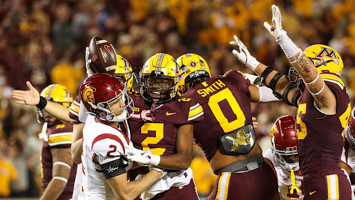 Oct 5, 2024; Minneapolis, Minnesota, USA; Minnesota Golden Gophers defensive back Ethan Robinson (2) celebrates his fumble recovery against the USC Trojans during the first half at Huntington Bank Stadium. Mandatory Credit: Matt Krohn-Imagn Images