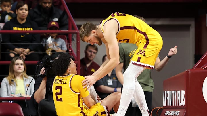 Nov 9, 2024; Minneapolis, Minnesota, USA; Minnesota Golden Gophers guard Mike Mitchell Jr. (2) grabs his leg after an injury during the second half against the Omaha Mavericks at Williams Arena. Mandatory Credit: Matt Krohn-Imagn Images Nov 9, 2024; Minneapolis, Minnesota, USA; Minnesota Golden Gophers guard Mike Mitchell Jr. (2) grabs his leg after an injury during the second half against the Omaha Mavericks at Williams Arena. Mandatory Credit: Matt Krohn-Imagn Images