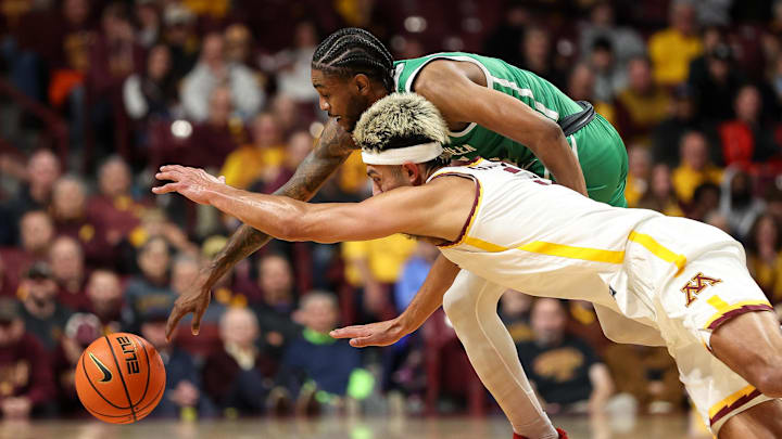 Nov 13, 2024; Minneapolis, Minnesota, USA; North Texas Mean Green guard Rondel Walker (5) and Minnesota Golden Gophers forward Dawson Garcia (3) dive for the ball during the first half at Williams Arena. Mandatory Credit: Matt Krohn-Imagn Images Nov 13, 2024; Minneapolis, Minnesota, USA; North Texas Mean Green guard Rondel Walker (5) and Minnesota Golden Gophers forward Dawson Garcia (3) dive for the ball during the first half at Williams Arena. Mandatory Credit: Matt Krohn-Imagn Images