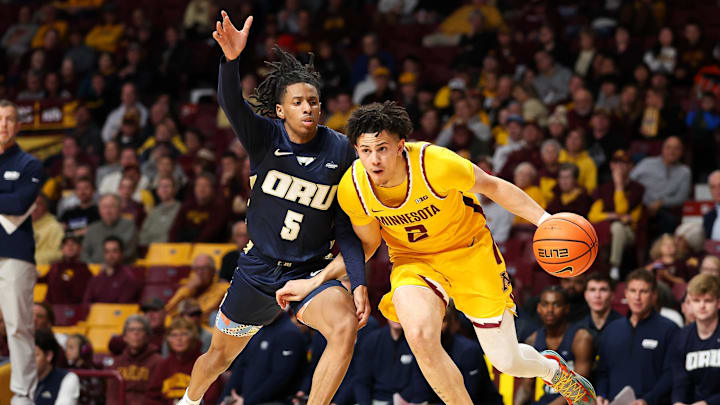 Minnesota guard Mike Mitchell Jr. works around Oral Roberts guard Darius Robinson Jr. (5) during the first half at Williams Arena in Minneapolis on Nov. 6, 2024. Minnesota guard Mike Mitchell Jr. works around Oral Roberts guard Darius Robinson Jr. (5) during the first half at Williams Arena in Minneapolis on Nov. 6, 2024.
