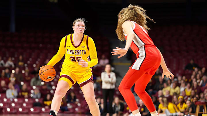 Feb 8, 2024; Minneapolis, Minnesota, USA; Minnesota Golden Gophers guard Grace Grocholski (25) dribbles as Ohio State Buckeyes guard Emma Shumate (5) defends during the first half at Williams Arena. Mandatory Credit: Matt Krohn-Imagn Images Feb 8, 2024; Minneapolis, Minnesota, USA; Minnesota Golden Gophers guard Grace Grocholski (25) dribbles as Ohio State Buckeyes guard Emma Shumate (5) defends during the first half at Williams Arena. Mandatory Credit: Matt Krohn-Imagn Images