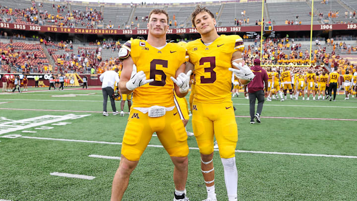 Sep 14, 2024; Minneapolis, Minnesota, USA; Minnesota Golden Gophers linebacker Maverick Baranowski (6) and defensive back Koi Perich (3) celebrate their teams win against the Nevada Wolf Pack after the game at Huntington Bank Stadium. Mandatory Credit: Matt Krohn-Imagn Images