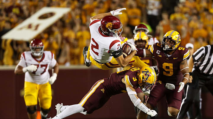 Oct 5, 2024; Minneapolis, Minnesota, USA; Minnesota Golden Gophers defensive back Koi Perich (3) tackles USC Trojans wide receiver Duce Robinson (2) during the second half at Huntington Bank Stadium. Mandatory Credit: Matt Krohn-Imagn Images Oct 5, 2024; Minneapolis, Minnesota, USA; Minnesota Golden Gophers defensive back Koi Perich (3) tackles USC Trojans wide receiver Duce Robinson (2) during the second half at Huntington Bank Stadium. Mandatory Credit: Matt Krohn-Imagn Images
