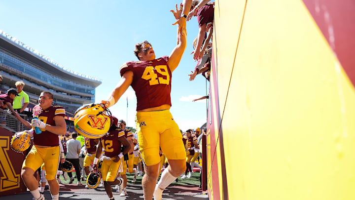 Sep 7, 2024; Minneapolis, Minnesota, USA; Minnesota Golden Gophers linebacker Matt Kingsbury (49) celebrates his teams win against the Rhode Island Rams after the game at Huntington Bank Stadium. Mandatory Credit: Matt Krohn-Imagn Images