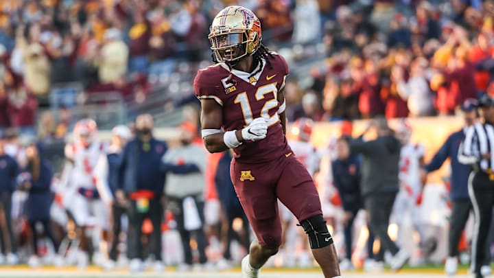 Nov 4, 2023; Minneapolis, Minnesota, USA; Minnesota Golden Gophers defensive back Darius Green (12) celebrates a fumble recovery against the Illinois Fighting Illini during the second half at Huntington Bank Stadium. Mandatory Credit: Matt Krohn-Imagn Images