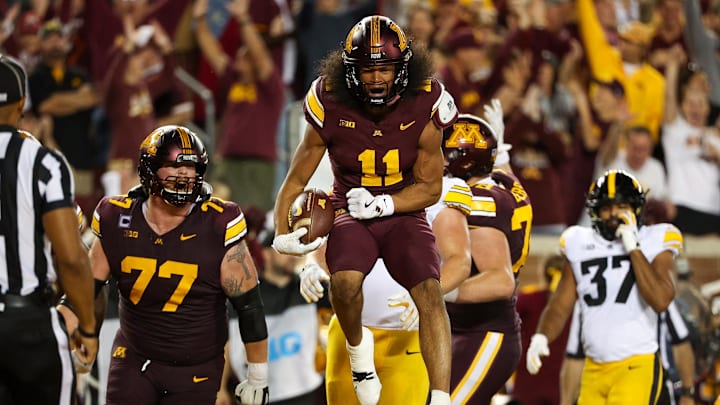 Sep 21, 2024; Minneapolis, Minnesota, USA; Minnesota Golden Gophers wide receiver Elijah Spencer (11) celebrates his touchdown against the Iowa Hawkeyes during the first half at Huntington Bank Stadium. Mandatory Credit: Matt Krohn-Imagn Images Sep 21, 2024; Minneapolis, Minnesota, USA; Minnesota Golden Gophers wide receiver Elijah Spencer (11) celebrates his touchdown against the Iowa Hawkeyes during the first half at Huntington Bank Stadium. Mandatory Credit: Matt Krohn-Imagn Images