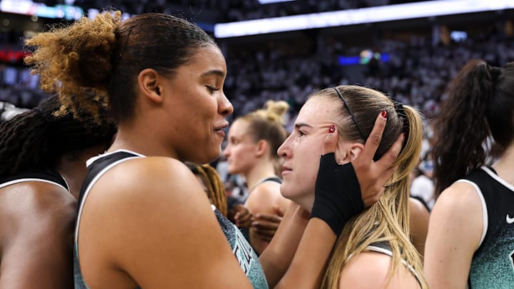 Oct 16, 2024; Minneapolis, Minnesota, USA; New York Liberty guard Sabrina Ionescu (20) celebrates her teams win forward Nyara Sabally (8) after game three of the 2024 WNBA Finals against the Minnesota Lynx at Target Center. Mandatory Credit: Matt Krohn-Imagn Images