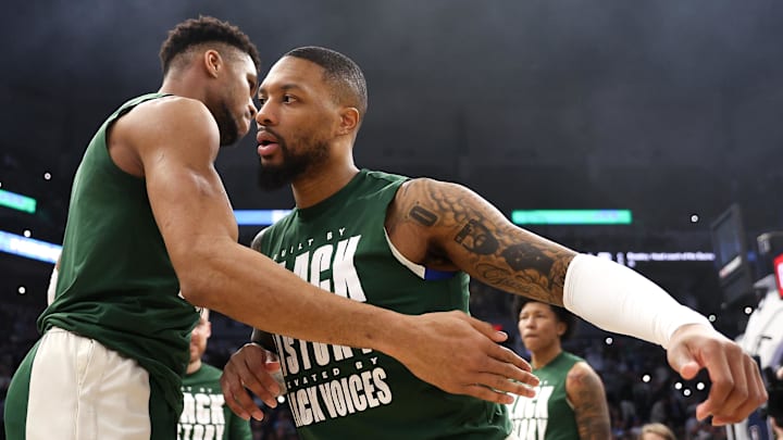 Feb 23, 2024; Minneapolis, Minnesota, USA; Milwaukee Bucks guard Damian Lillard (0) and forward Giannis Antetokounmpo (34) shake hands before the start of the game against the Minnesota Timberwolves at Target Center. Mandatory Credit: Matt Krohn-Imagn Images