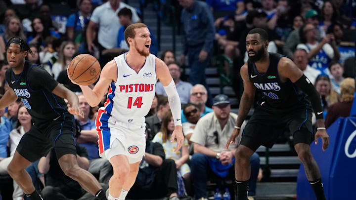 Apr 12, 2024; Dallas, Texas, USA; Detroit Pistons guard Malachi Flynn (14)  controls the ball as Dallas Mavericks forward Tim Hardaway Jr. (10) defends during the first half at American Airlines Center. Mandatory Credit: Chris Jones-Imagn Images