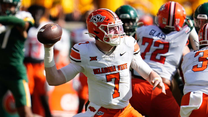 Oct 26, 2024; Waco, Texas, USA; Oklahoma State Cowboys quarterback Alan Bowman (7) drops back to throw against the Baylor Bears during the first half at McLane Stadium. Mandatory Credit: Chris Jones-Imagn Images Oct 26, 2024; Waco, Texas, USA; Oklahoma State Cowboys quarterback Alan Bowman (7) drops back to throw against the Baylor Bears during the first half at McLane Stadium. Mandatory Credit: Chris Jones-Imagn Images